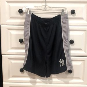 NY Yankees men’s shorts. Colors are blue and grey. Side pockets with drawstring